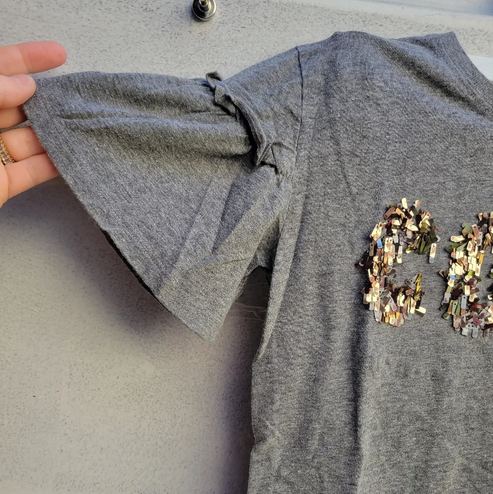 Justice oblong rectangle sequin wording top shirt with short bell ruffled sleeve